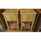 A pair of light wood two drawer bedside tables