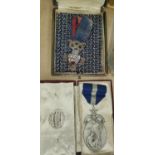 A Corporal W Watkins Silver Rifle shooting hall marked silver medal with enamel shield 78-4 and a