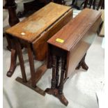 An Edwardian walnut Sutherland table; an oak Sutherland table; an ebonised nursing chair; 2