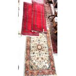 Two modern Bokhara runner rugs with red ground, a similar cream rug and two woolen rugs