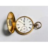 A gent's half hunter keyless pocket watch in yellow metal, the front cover stamped '18c', gross
