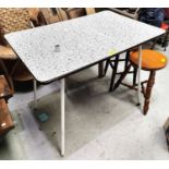 A 1950's tubular occasional table with rectangular black & white Formica top