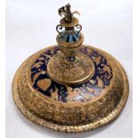 A continental brass and blue enamel lid decorated with birds and trees with finial vase to top