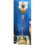 A 19th century brass Corinthian column standard  oil lamp on square base and paw feet (converted)