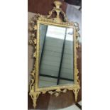 A late 18th century style rectangular wall mirror, the gilt frame with trailed leaves and cornucopia