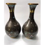 A pair of late 19th/ early 20th century cloisonne vases, black ground with coloured and gilt