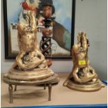 A pair of gilt plaster wall brackets in the form of cherubs; a papier mâché table lamp base; a brass