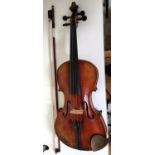 A late 19th early 20th century full size violin two piece back violin stamped and labelled to the