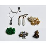 An Edwardian gem set necklace on fine chain; a pair of opaque white drop earrings; a jade coloured