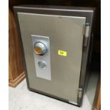A small SSTL safe with key and dial locking system 51 x 40 x 34cm