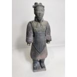 A Chinese ceramic figure of a warrior in the manor of a Terracotta army soldier, height 27cm