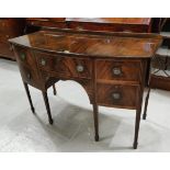 A Georgian style mahogany inlaid drop leaf sideboard with rounded front, five drawers, on tapering