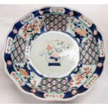 A 19th century Japanese Imari dish with scalloped and lobed edges floral decoration, circle marks to