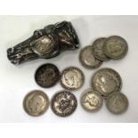 A continental silver vesta case in the shape of a horses head and a small collection of coins some