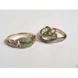 A lady's 9 carat gold dress ring set 4 small tsavorite stones and 12 white sapphires, size M/N; a