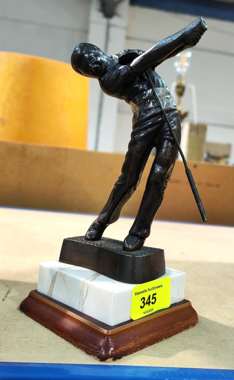 A bronzed golf trophy "Teeing Off" on marble plinth, ht 21cm