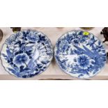 A pair of Japanese blue and white scalloped edged chargers decorated with plants 39cm