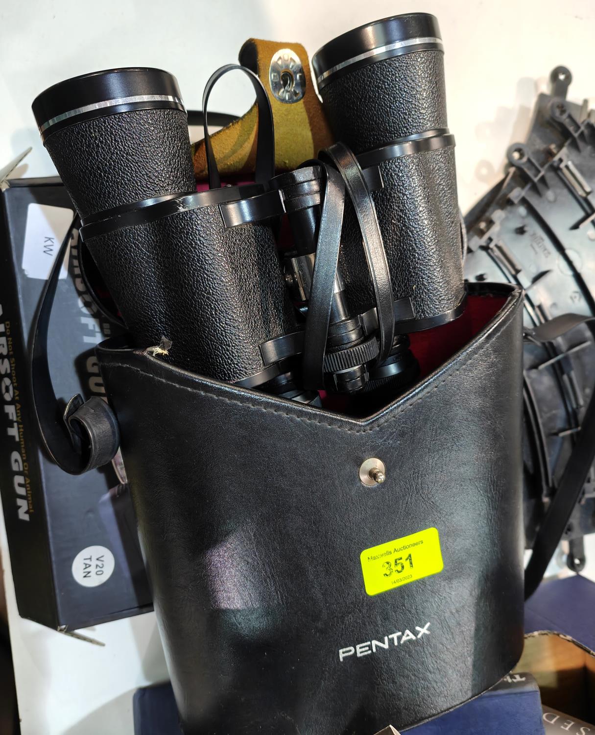 A cased pair of Pentax 16 x 50 binoculars; an "Airsoft" toy gun