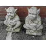 A pair of large reconstituted stone threshold Gargoyles playing cards, height 51cm