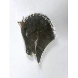 Georg Jensen:  a brooch in the form of a stylised horse's head with mirror like finish, numbered 90,