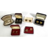 A selection of modern gilt cufflinks in jewellery boxes