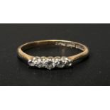 A yellow metal ring stamped '18ct', set 5 small graduating diamonds, size 'N', 2gm