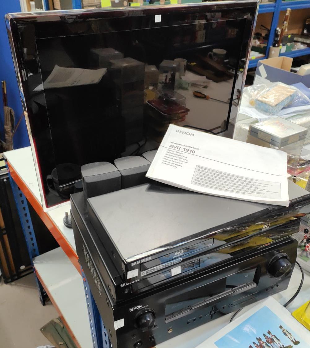 A Samsung 31" flatscreen TV with stand; DVD player; etc.
