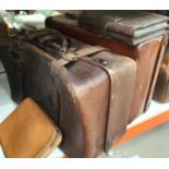 Three vintage leather suitcases; smaller cases; etc.