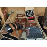 A selection of vintage cameras; cases; binoculars; etc.