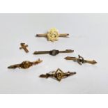 Five yellow metal bar brooches and a cross, stamped '9ct', 8.4gm