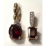 A 9K gold pendant set octagonal raspberry rhodolite stone, 5 small diamonds to the loop; a 9K gold