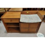 A Parker Knoll teak telephone/hall seat with cupboard, drawer and shelving