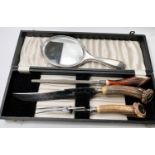 A cased Horn handle three piece carving set; a hall mark silver and tortoise shell backed hand