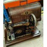A vintage domed cased sewing machine