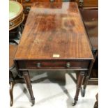 An early 19th century mahogany Pembroke table with frieze drawer, on turned legs