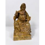 A carved brown soapstone figure of a seated Chines sage height 20cm