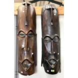 An early/mid 20th century pair of large African face masks, height 92cm