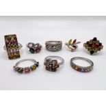 8 silver rings stamped '925' with multi-coloured stones in a variety of settings gross weight