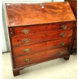 A George III mahogany fall front bureau with fitted interior, 4 graduating drawers with brass drop