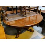 A Victorian oval extending dining table on hexagonal tapering column on 4 splay feet, 1 spare