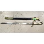 A British Naval dress short sword with engraved blade 59cm overall, blade 46cm, brass mounted