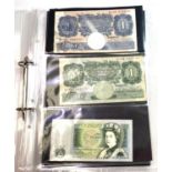 A collection of banknotes in an album: 2 green Peppiatt £1 notes, 4 blue Page £1 notes, 7