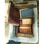 A collection of antique hard back books on various subjects