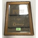 A gilt framed advertising mirror lettered 'Bourneville Cocoa Made by "Cadbury"' 29x19cm
