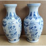 A pair of modern Chinese blue and white baluster vases, 5 character signatures to base, ht. 27cm