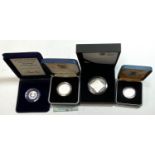 A 2008 silver proof £5, 'Queen Elizabeth I'; a silver proof Commonwealth Games £2 1986, a silver