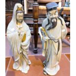 A pair of Chinese porcelain figures of male and female Immortals, height 43cm