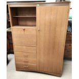 A 1960's lightwood combination wardrobe