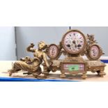 A 19th century gilt metal and pink ground Sevres style porcelain mantle clock surmounted by a