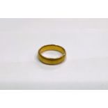 A 22 carat hallmarked gold wedding ring, 4.9gms, size I/J